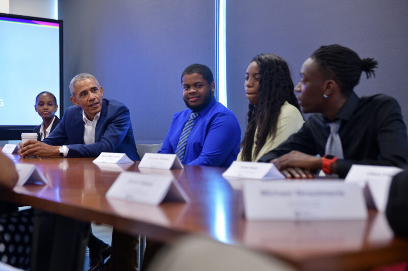 President Obama speaks with young leaders at a round table discussion.