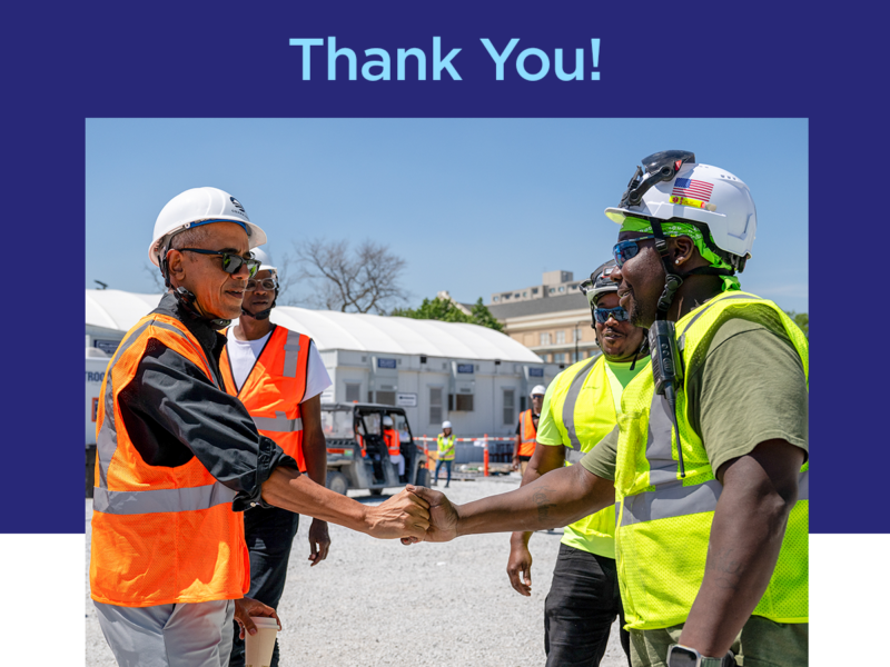 A the top, the words "thank you!" accompanied by an image of President Obama wearing a hard hat and a bright orange construction vest shaking the hands of a man with a dark skin-tone also wearing a hard hat and a bright yellow construction vest. 